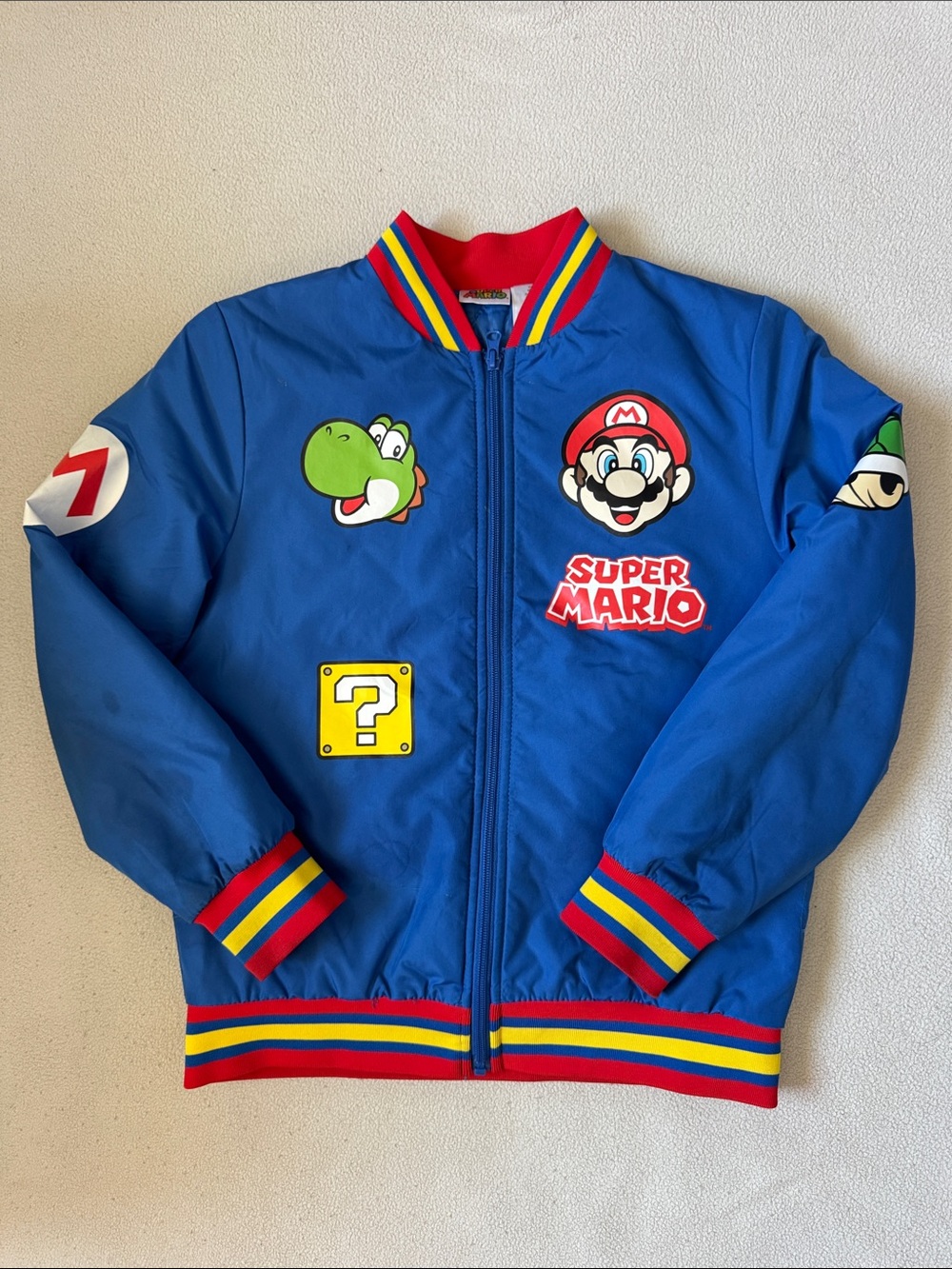 Nintendo Super Mario Blue Bomber Jacket with Red-Yellow-Green Trim